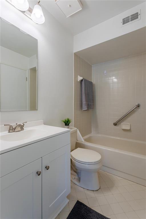4428 Middlebrook Road, Unit 4 Orlando, FL 32811 - Photo 22 of 28 a bathroom with a sink a toilet and a mirror