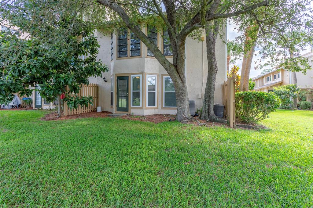 4428 Middlebrook Road, Unit 4 Orlando, FL 32811 - Photo 25 of 28 a front view of a house with a yard