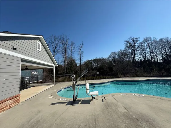 a swimming pool with a yard