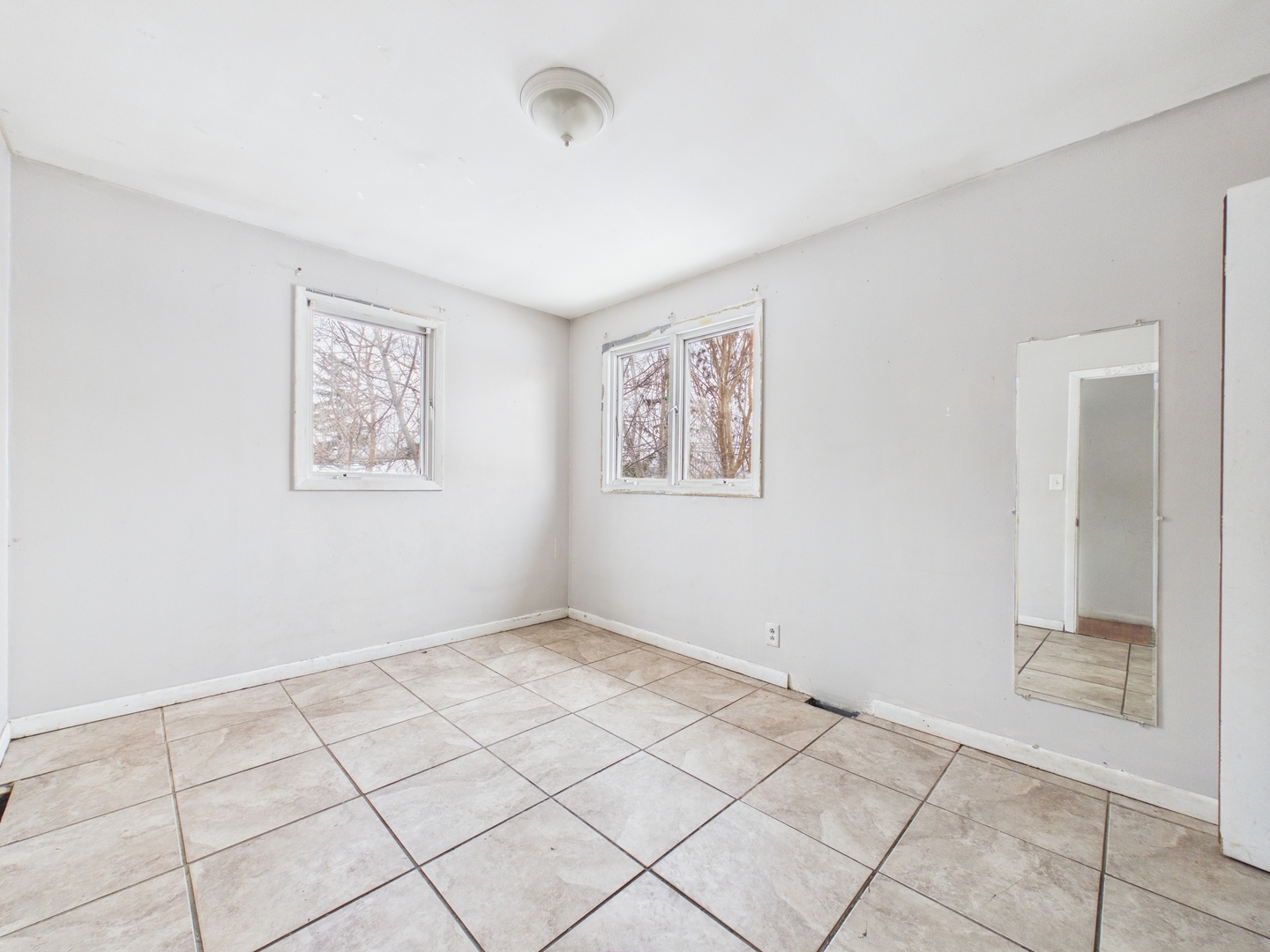 4707 West 82nd Place Chicago, IL 60652 - Photo 12 of 23 a view of an empty room and window