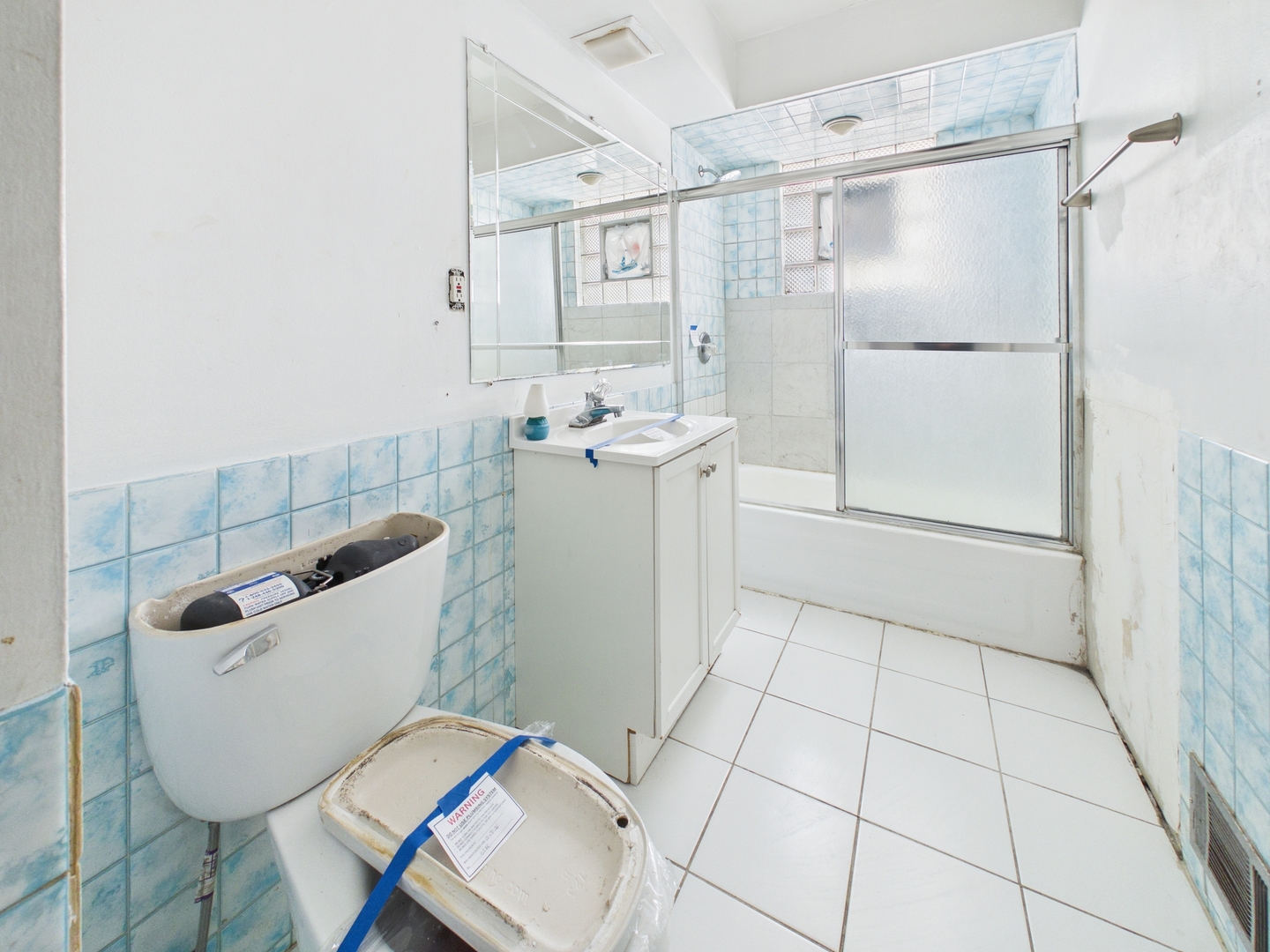 4707 West 82nd Place Chicago, IL 60652 - Photo 16 of 23 a bathroom with a sink toilet and shower