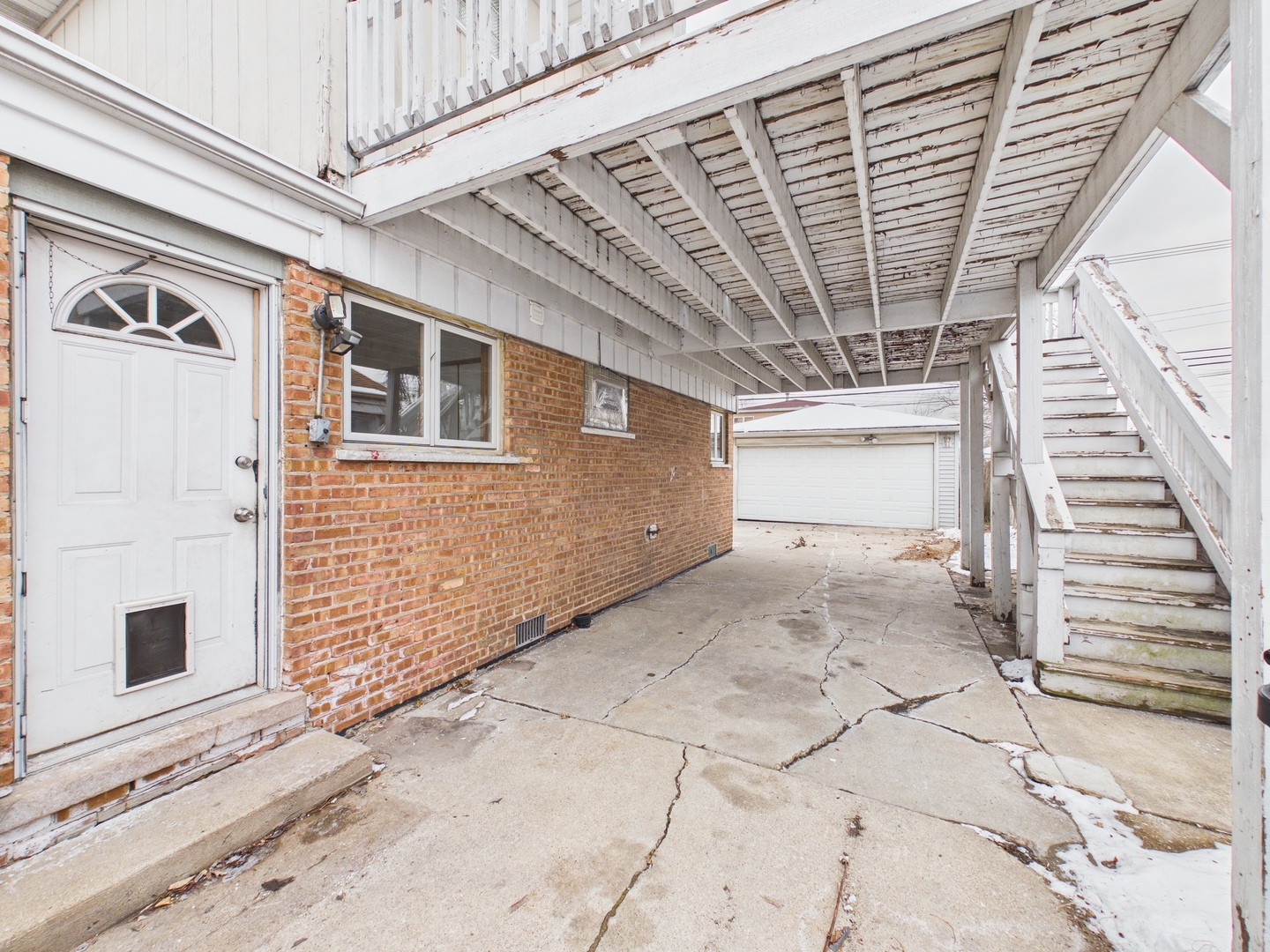 4707 West 82nd Place Chicago, IL 60652 - Photo 23 of 23 a view of a hallway with wooden walls