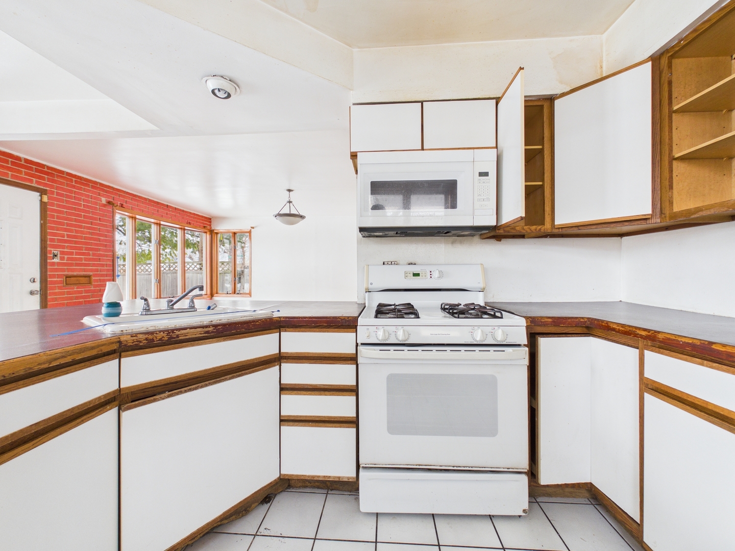 4707 West 82nd Place Chicago, IL 60652 - Photo 6 of 23 a kitchen with stainless steel appliances granite countertop a stove and a sink