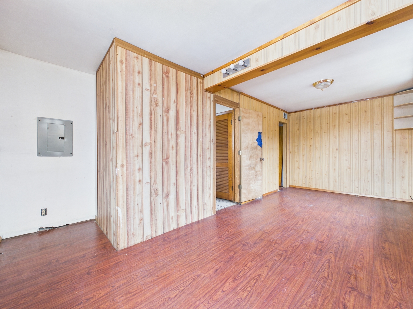4707 West 82nd Place Chicago, IL 60652 - Photo 9 of 23 a view of an empty room with wooden floor