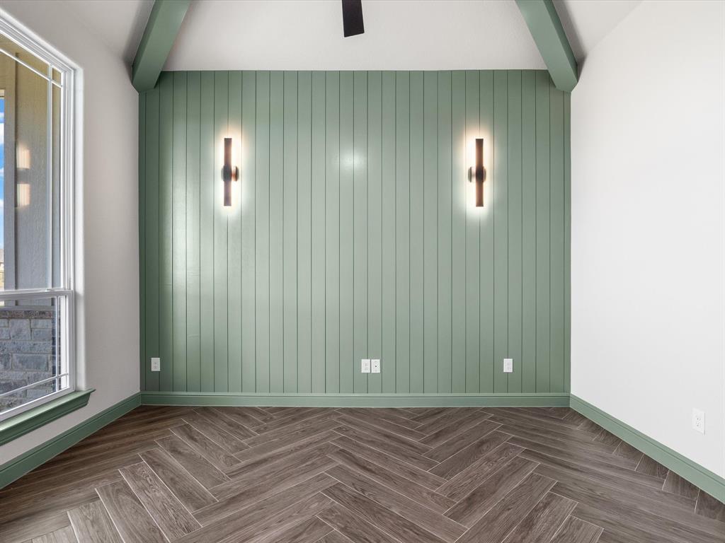 161 Frontera Drive Decatur, TX 76234 - Photo 13 of 40 a view of an empty room with wooden floor and a window