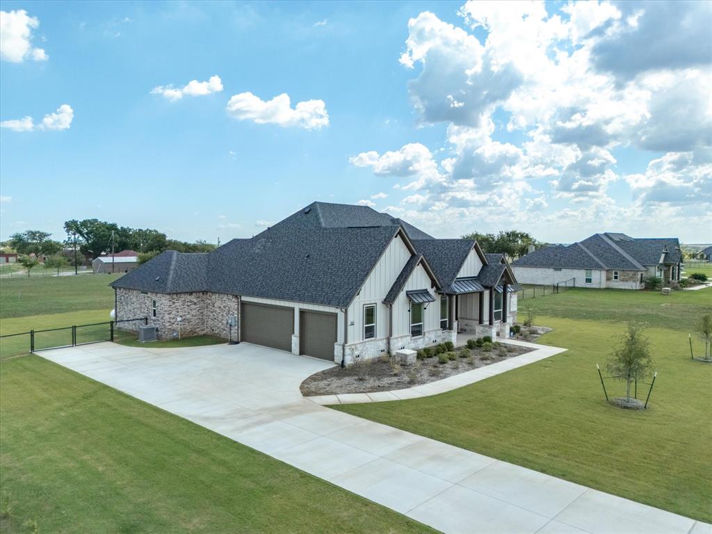 161 Frontera Drive Decatur, TX 76234 - Photo 3 of 40 a front view of a house with garden