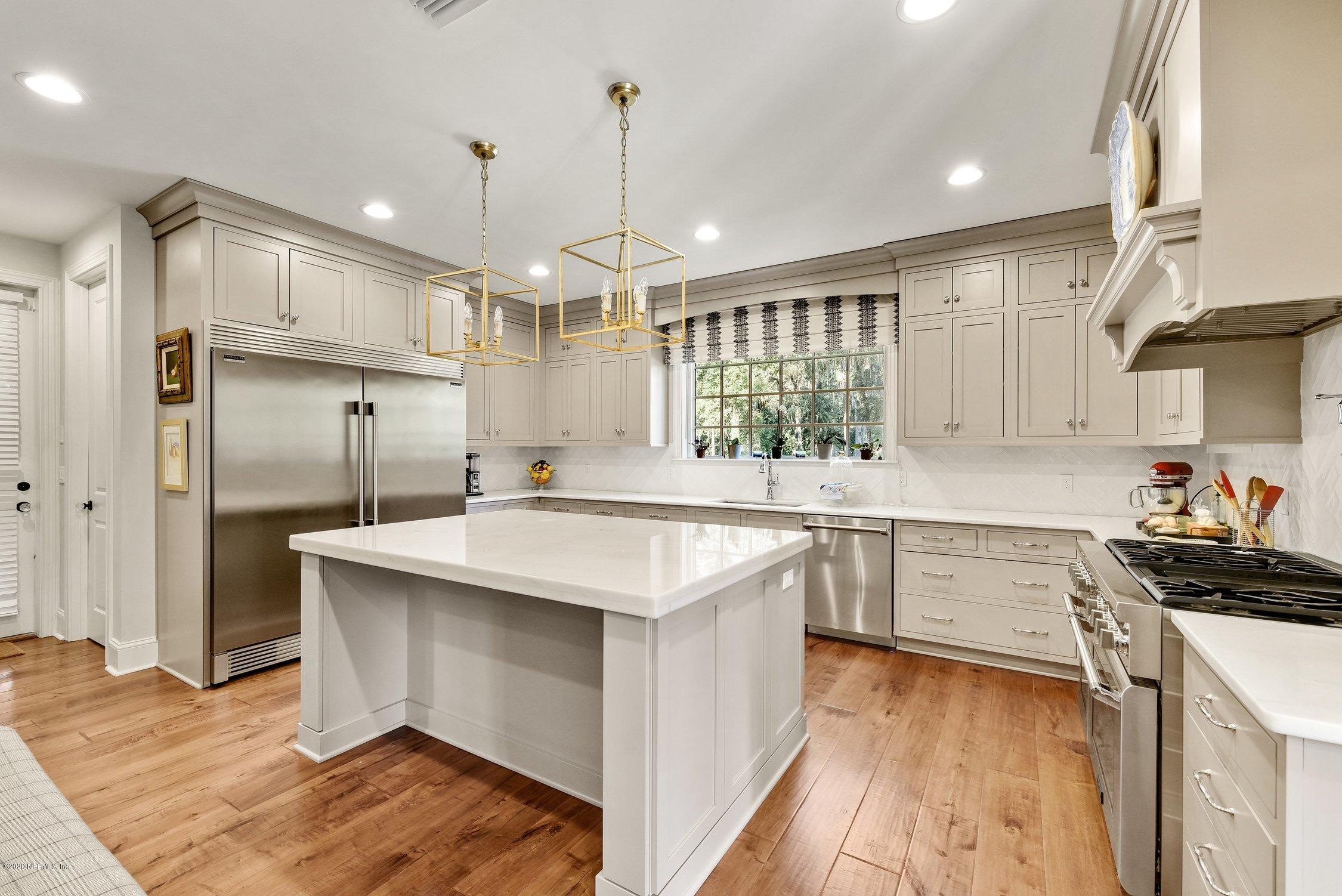 1217 Wedgewood Road Fruit Cove, FL 32259 - Photo 17 of 69 a kitchen with a sink stove and refrigerator