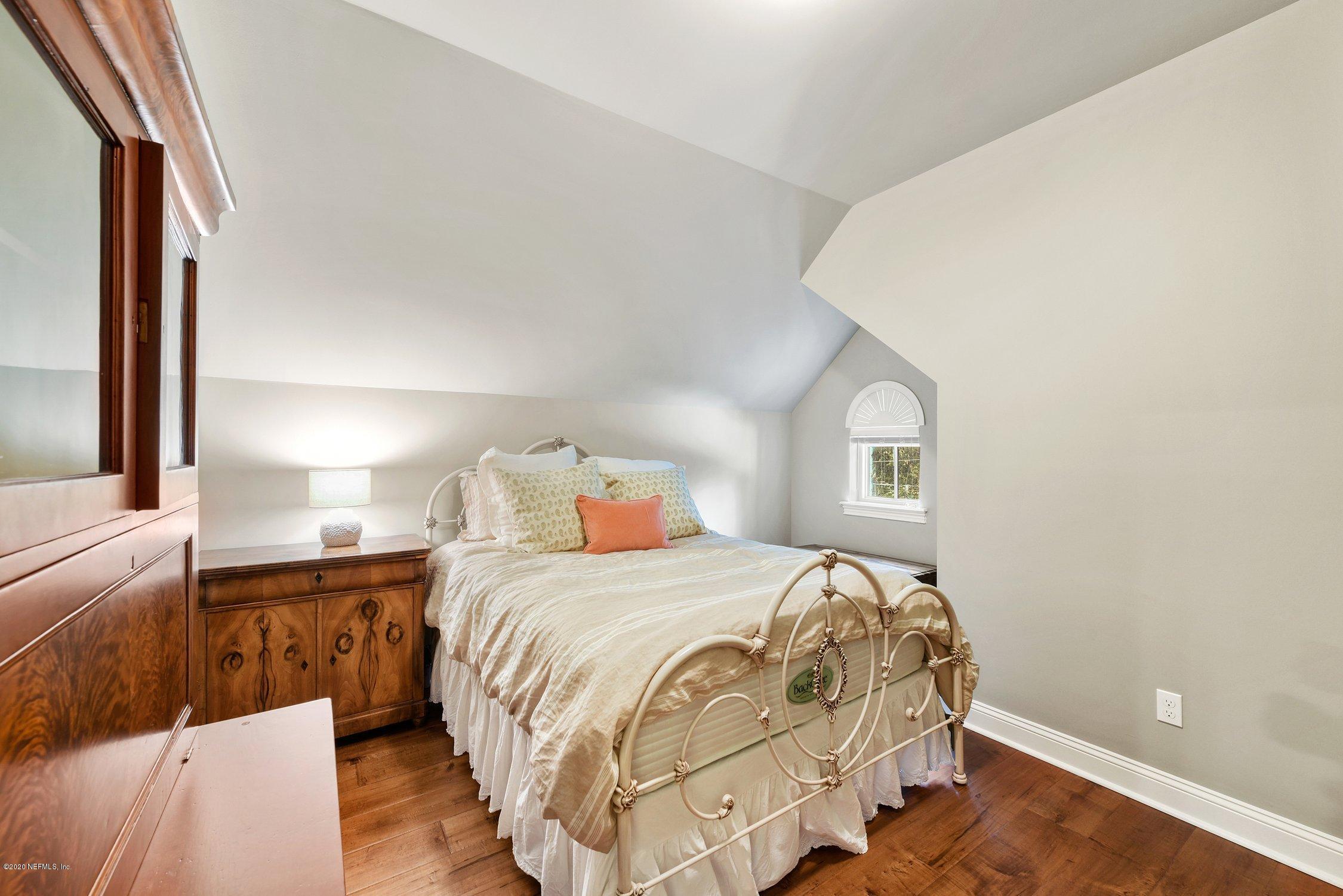 1217 Wedgewood Road Fruit Cove, FL 32259 - Photo 39 of 69 a bedroom with a bed and a night stand