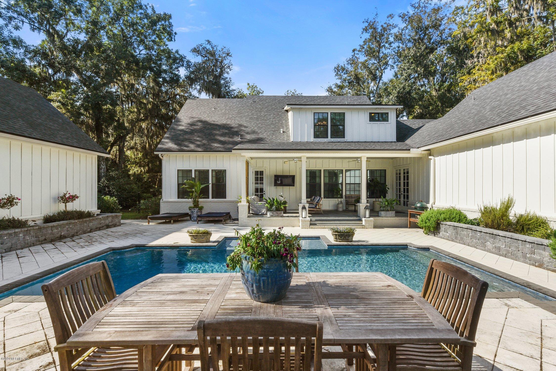 1217 Wedgewood Road Fruit Cove, FL 32259 - Photo 59 of 69 a view of a house with backyard sitting area and swimming pool