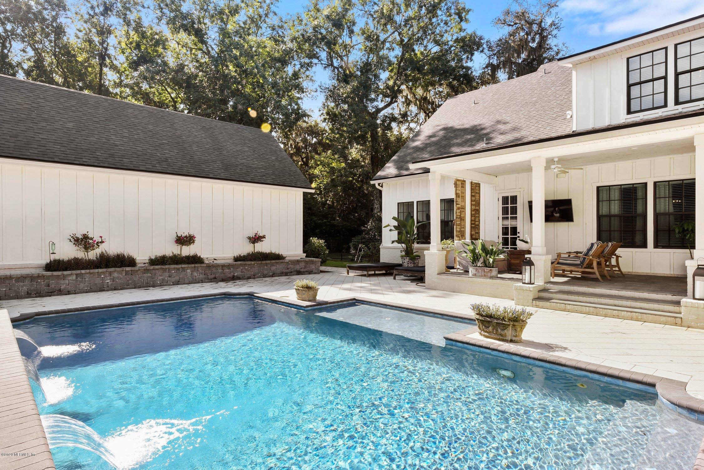 1217 Wedgewood Road Fruit Cove, FL 32259 - Photo 60 of 69 a view of a patio with swimming pool table and chairs