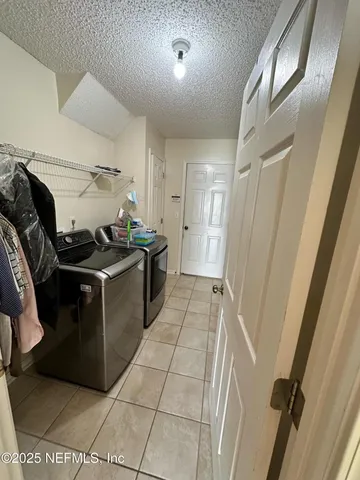 a kitchen with a stove and a refrigerator