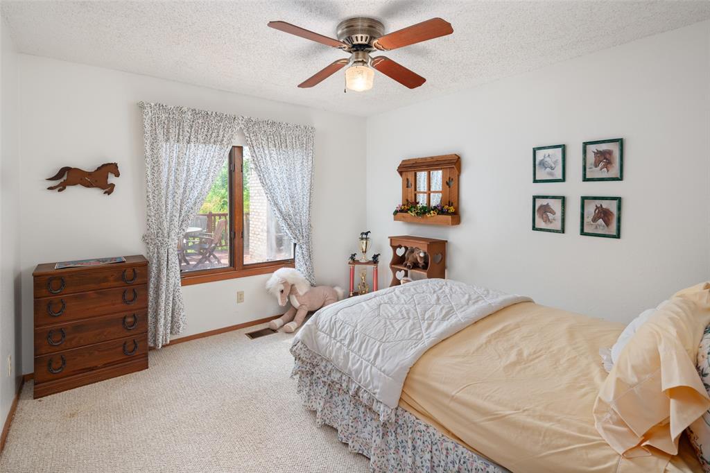 1251 Jim Cannon Road Van Alstyne, TX 75495 - Photo 11 of 31 a bedroom with a bed and a dresser