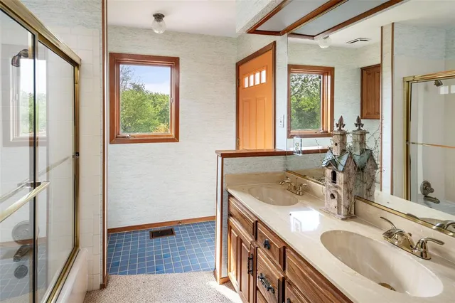 a spacious bedroom with a bed and a couch