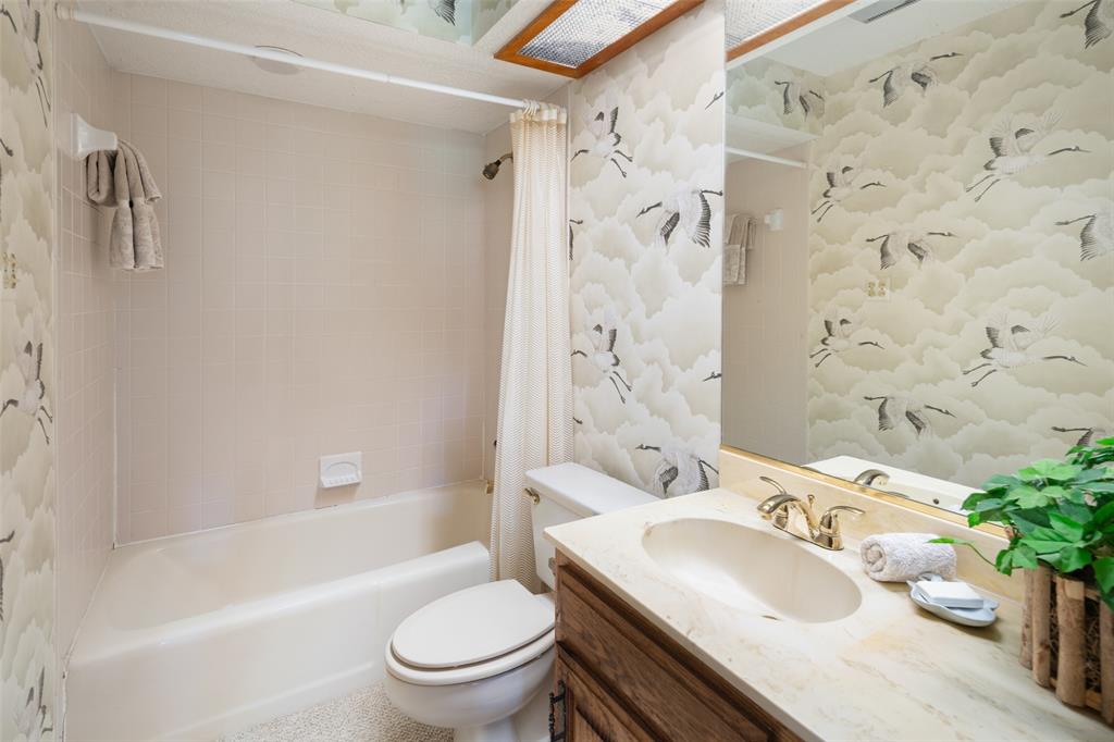 1251 Jim Cannon Road Van Alstyne, TX 75495 - Photo 15 of 31 a bathroom with a sink toilet tub and shower