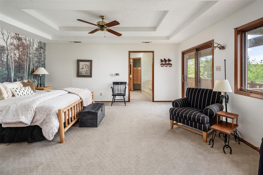 1251 Jim Cannon Road Van Alstyne, TX 75495 - Photo 16 of 31 a spacious bedroom with a bed and a couch