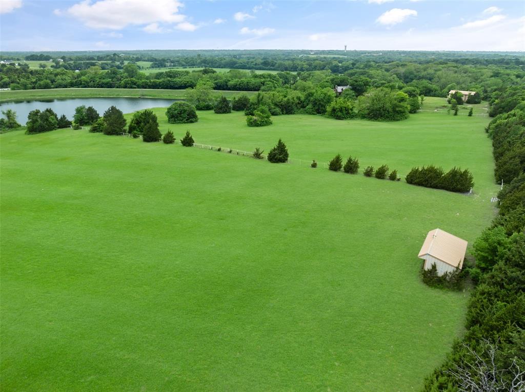 1251 Jim Cannon Road Van Alstyne, TX 75495 - Photo 28 of 31 a view of a golf course with a garden