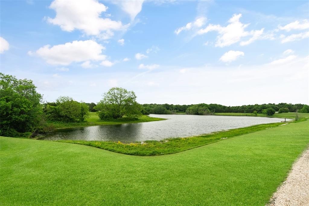 1251 Jim Cannon Road Van Alstyne, TX 75495 - Photo 30 of 31 a view of a lake with a big yard