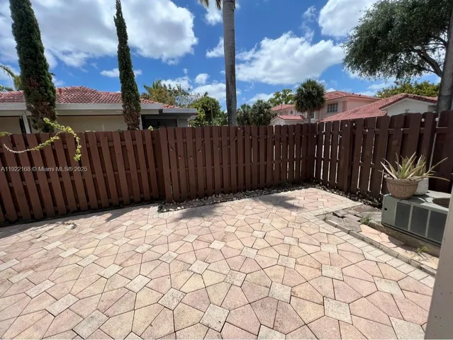 a view of a backyard of the house