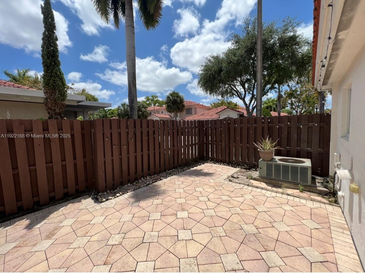 7317 Northwest 173rd Drive, Unit 104 Hialeah, FL 33015 - Photo 19 of 22 a view of backyard with a trees