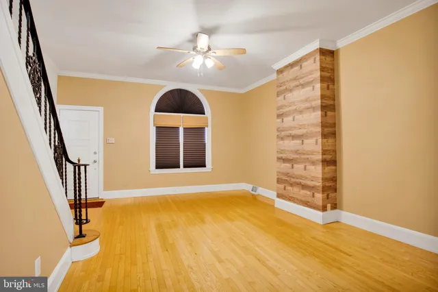 a view of an entryway with wooden floor