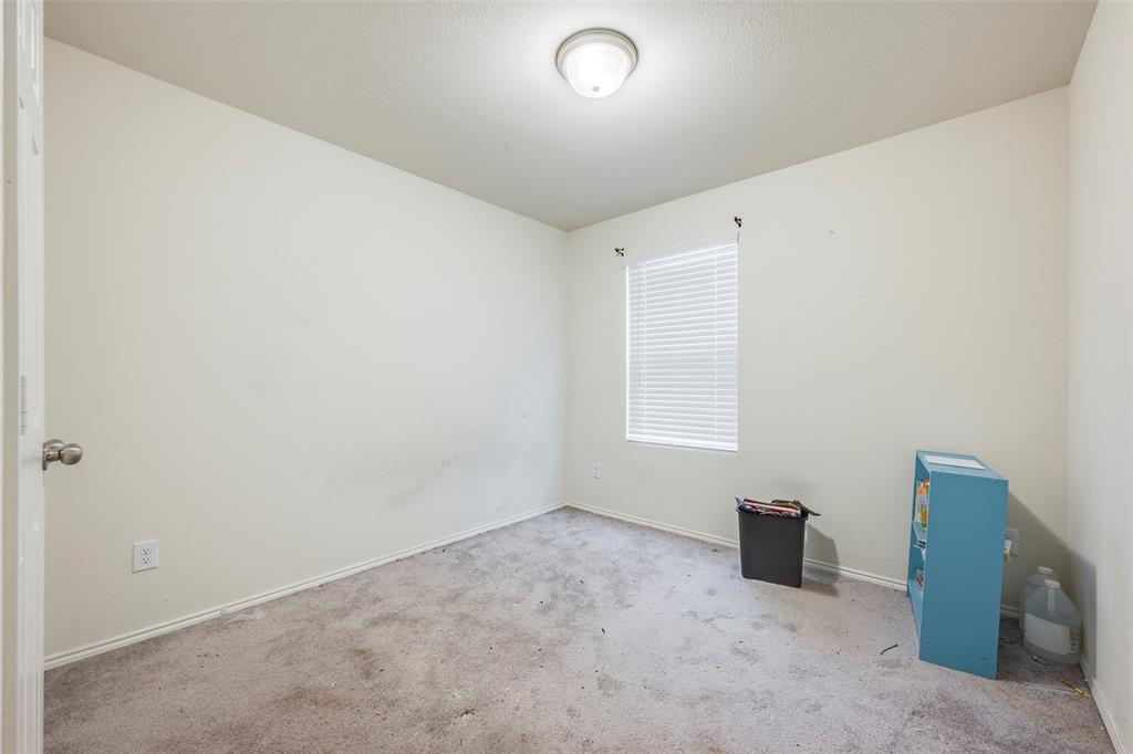 1062 Spofford Drive Forney, TX 75126 - Photo 17 of 23 an empty room with windows