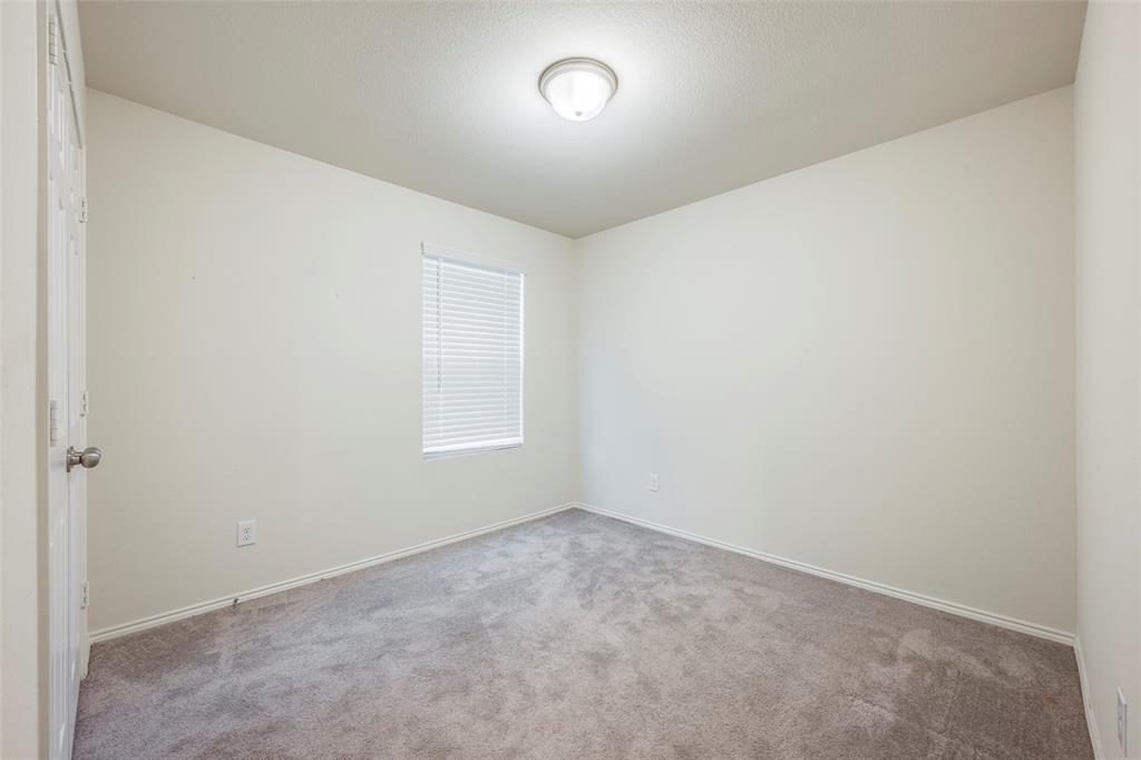 1062 Spofford Drive Forney, TX 75126 - Photo 20 of 23 an empty room with a window