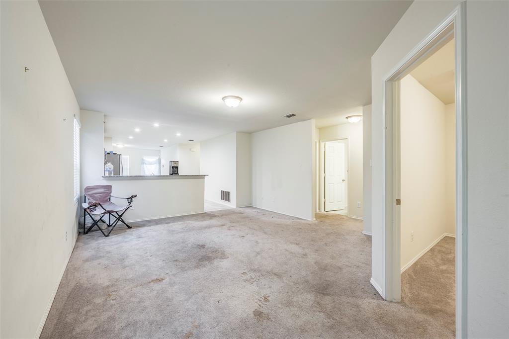1062 Spofford Drive Forney, TX 75126 - Photo 4 of 23 a view of a livingroom and a kitchen