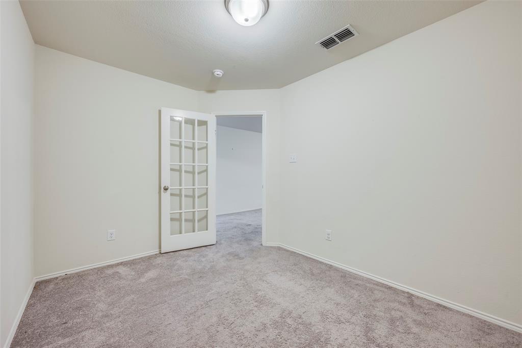 1062 Spofford Drive Forney, TX 75126 - Photo 8 of 23 an empty room with windows