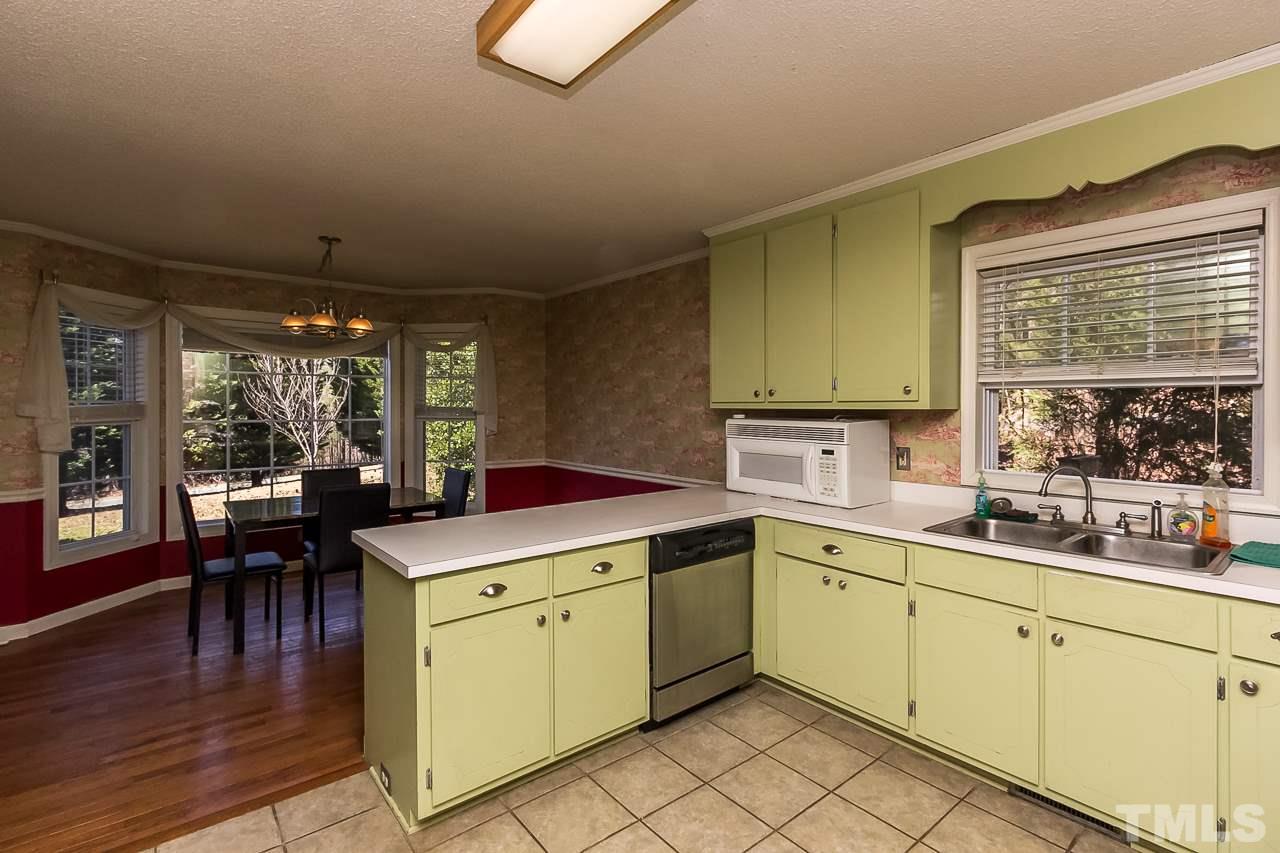 3518 Moriah Road Rougemont, NC 27572 - Photo 11 of 25 a kitchen with a sink cabinets and wooden floor