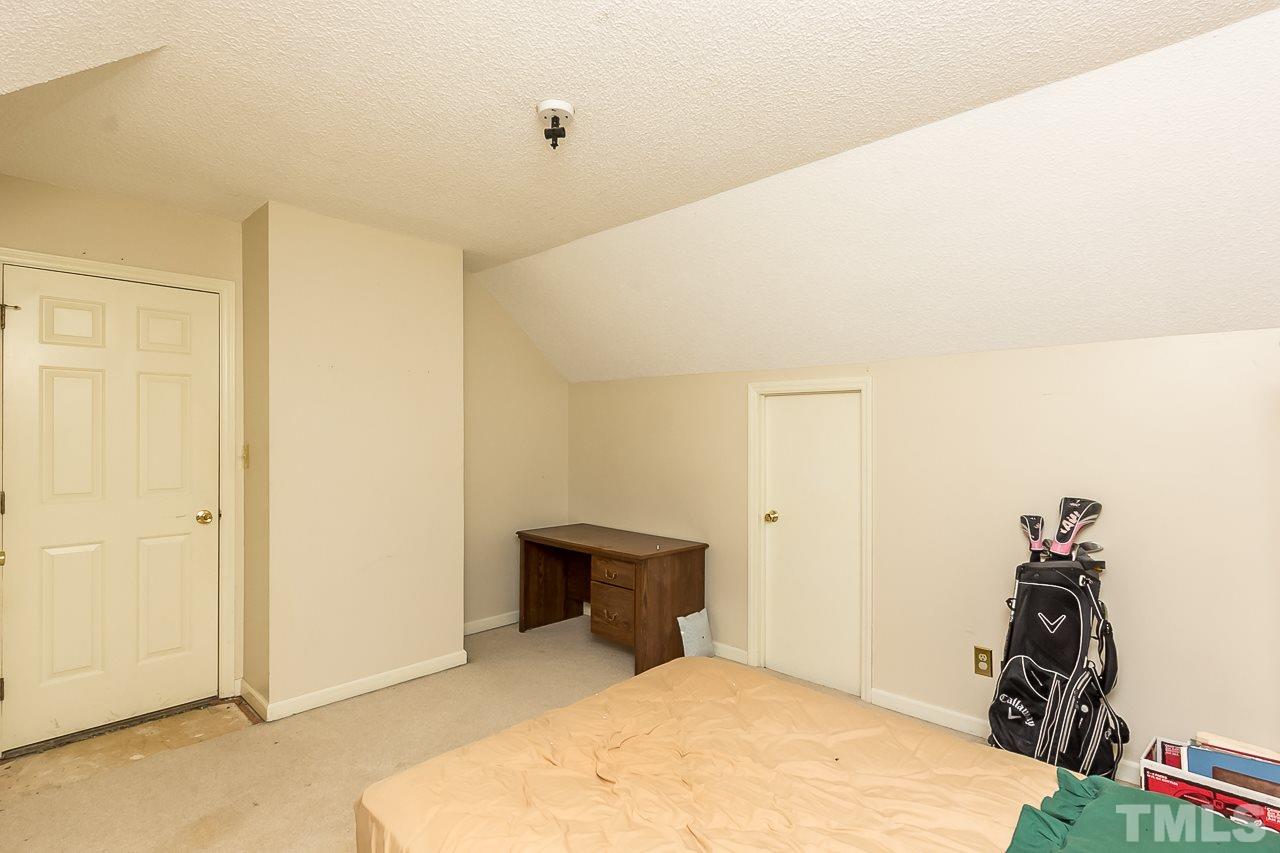 3518 Moriah Road Rougemont, NC 27572 - Photo 15 of 25 a bed room with a bed and a closet