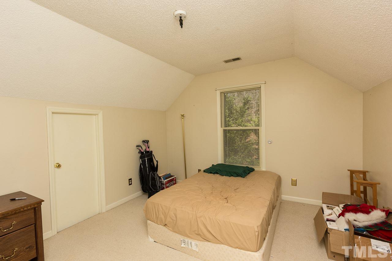 3518 Moriah Road Rougemont, NC 27572 - Photo 16 of 25 a bedroom with a bed and a window