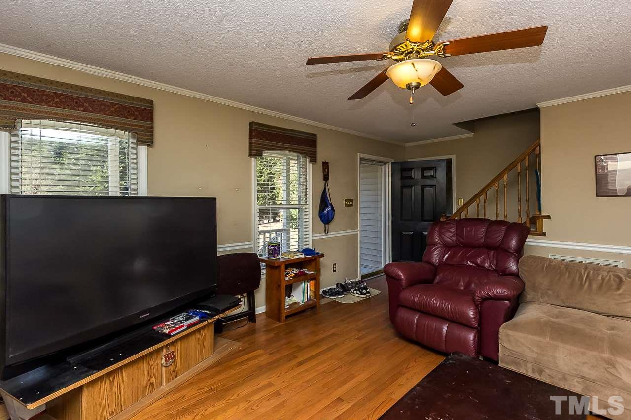 3518 Moriah Road Rougemont, NC 27572 - Photo 3 of 25 a living room with furniture and a flat screen tv