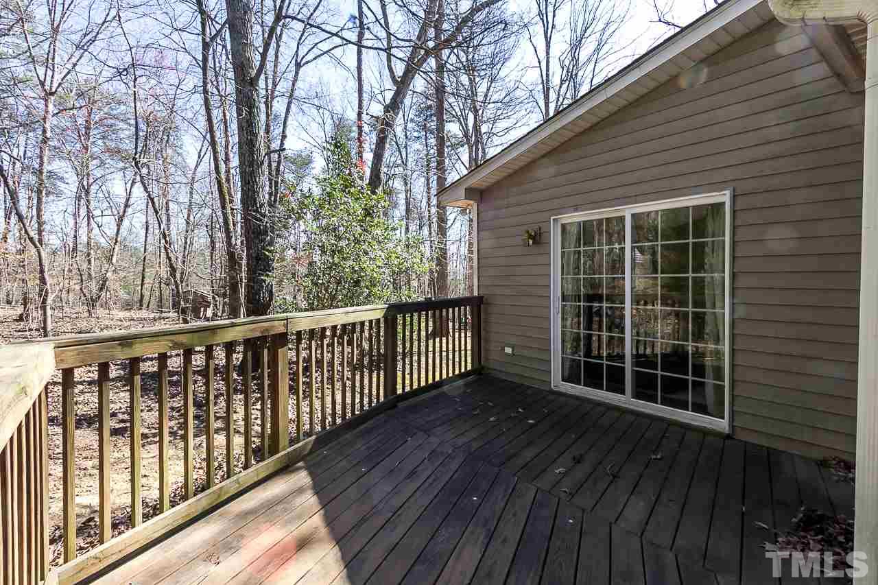 3518 Moriah Road Rougemont, NC 27572 - Photo 21 of 25 a view of a roof deck with wooden floor and fence