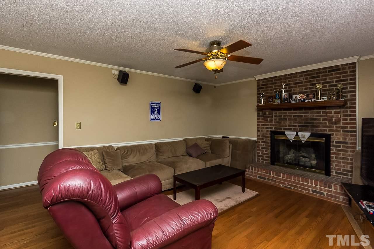 3518 Moriah Road Rougemont, NC 27572 - Photo 5 of 25 a living room with furniture a fireplace