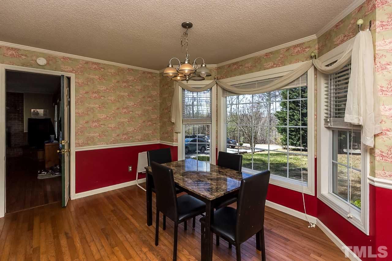 3518 Moriah Road Rougemont, NC 27572 - Photo 8 of 25 a view of a dining room with furniture window and wooden floor
