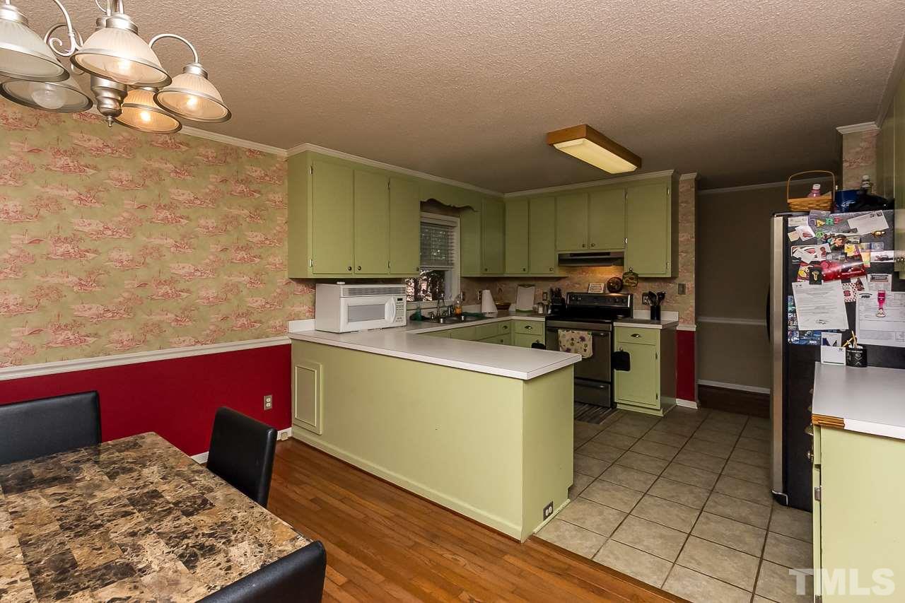 3518 Moriah Road Rougemont, NC 27572 - Photo 9 of 25 a kitchen with a sink cabinets and wooden floor