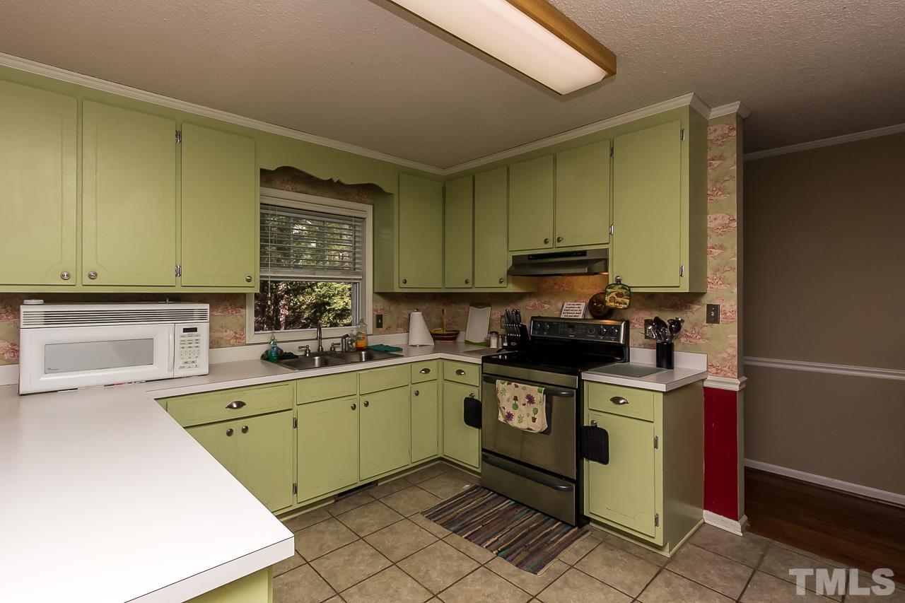 3518 Moriah Road Rougemont, NC 27572 - Photo 10 of 25 a kitchen with a sink cabinets and stainless steel appliances