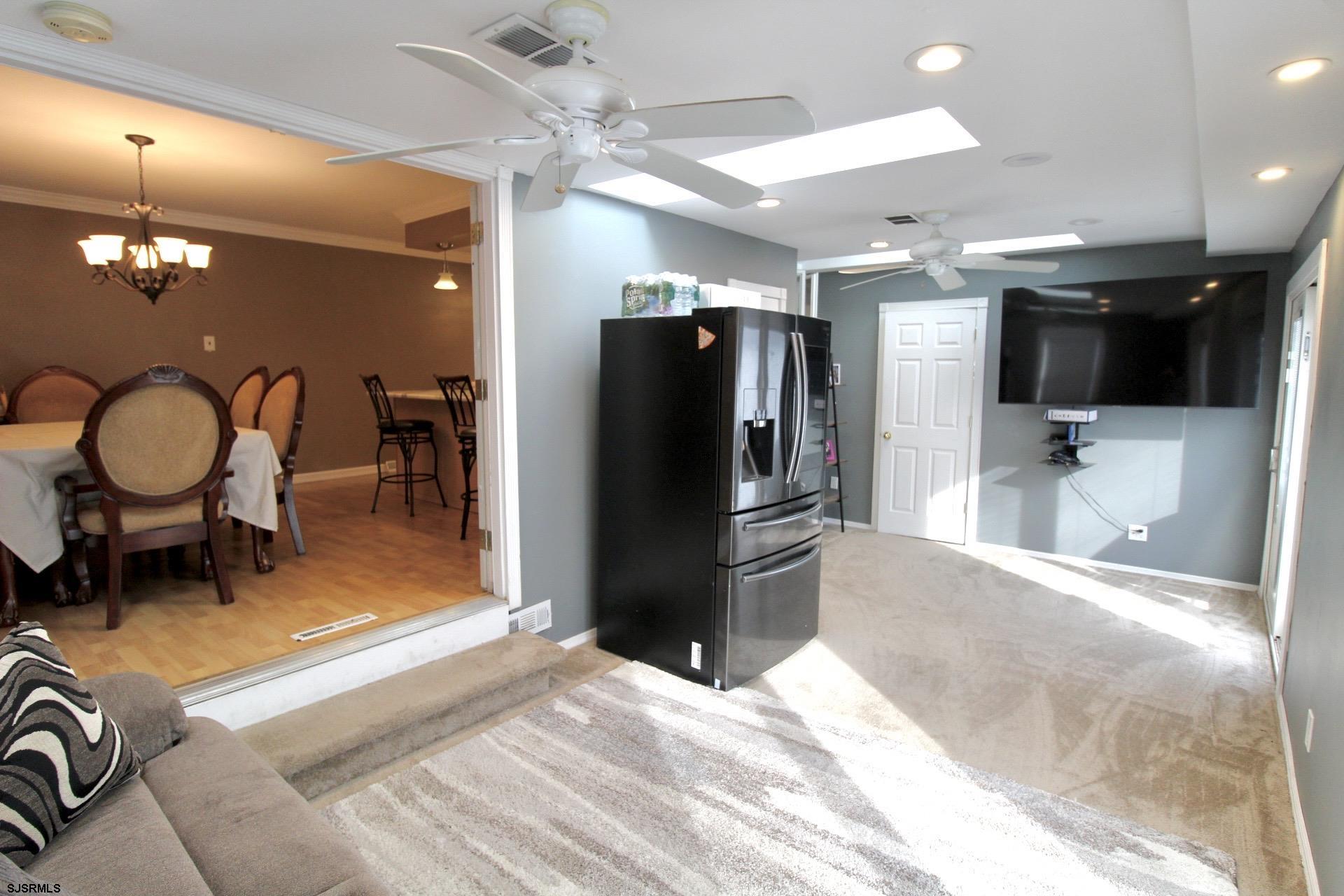107 Spray Avenue Egg Harbor Township, NJ 08234 - Photo 13 of 38 a view of a livingroom with furniture and a kitchen