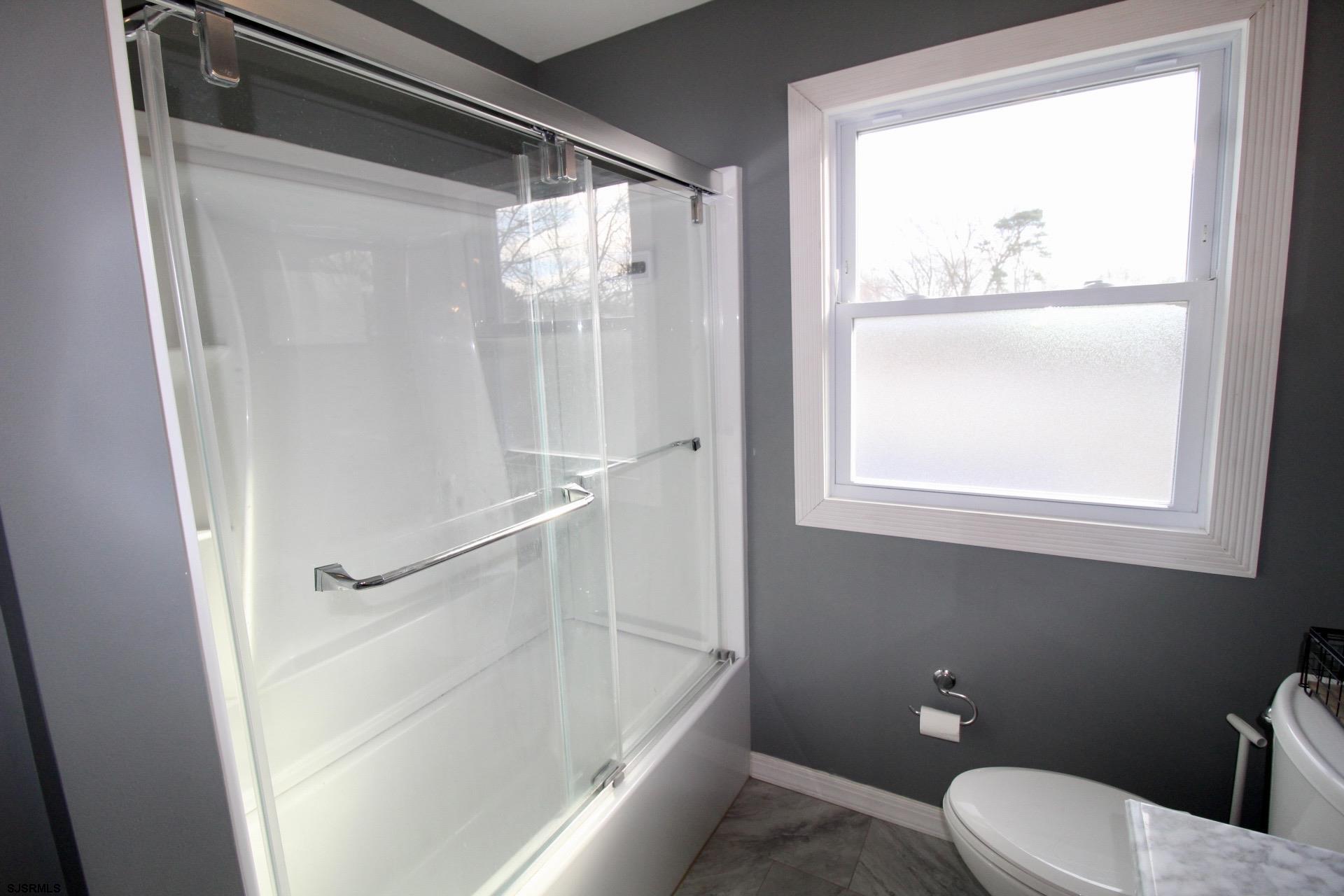 107 Spray Avenue Egg Harbor Township, NJ 08234 - Photo 26 of 38 a bathroom with a toilet and a shower