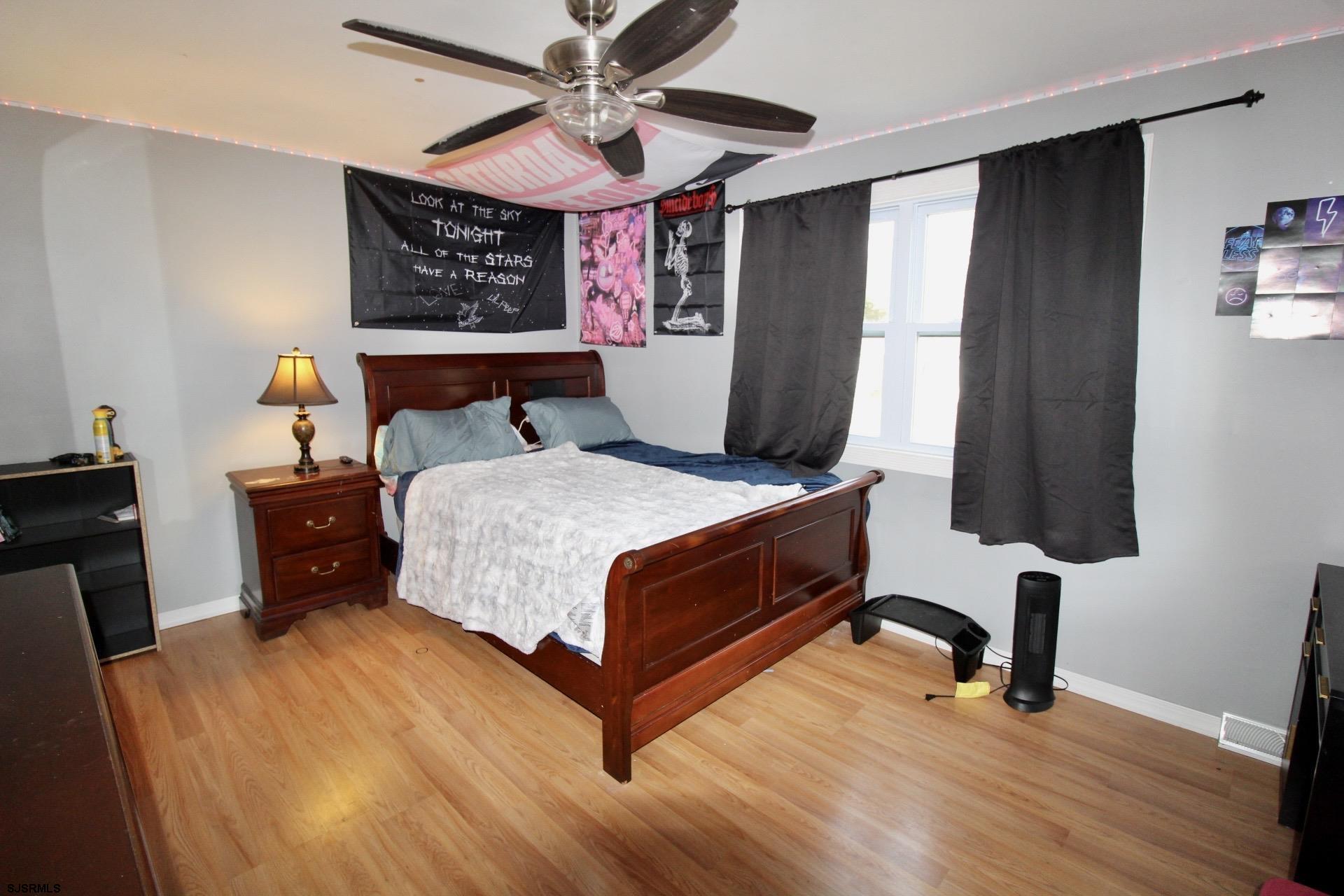 107 Spray Avenue Egg Harbor Township, NJ 08234 - Photo 27 of 38 a bed room with a bed window and a chair