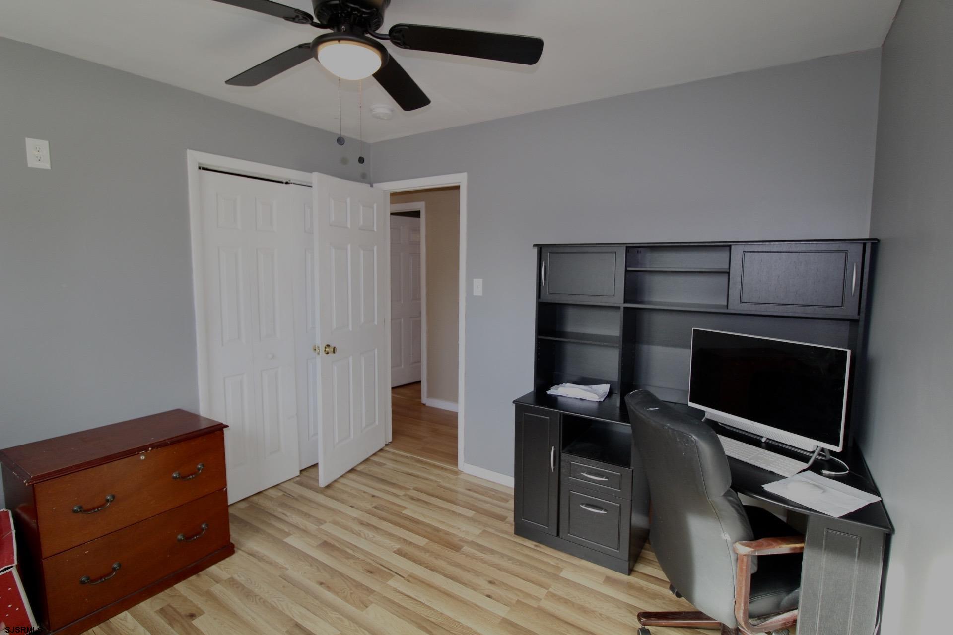 107 Spray Avenue Egg Harbor Township, NJ 08234 - Photo 30 of 38 a view of a hallway with wooden floor and closet
