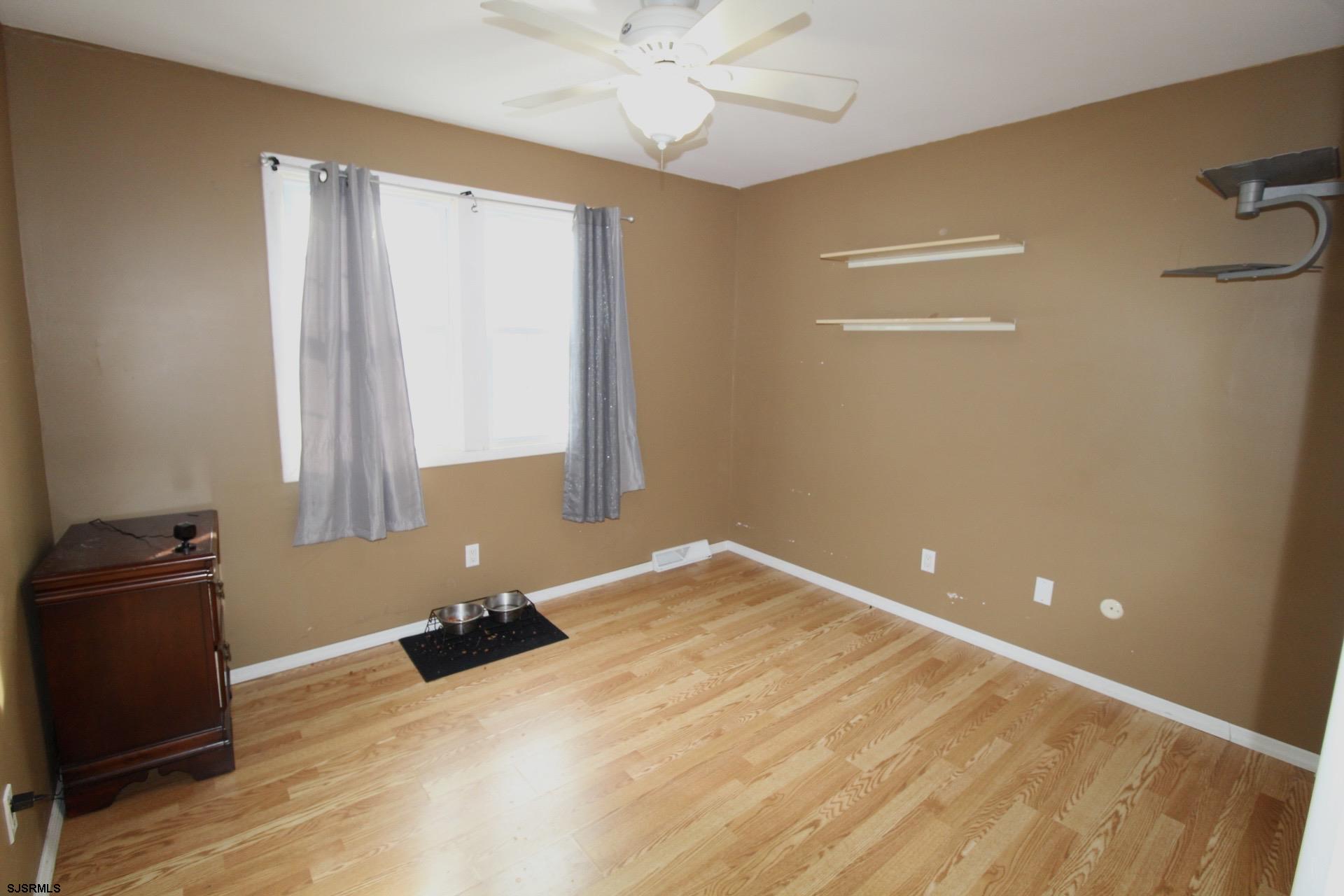 107 Spray Avenue Egg Harbor Township, NJ 08234 - Photo 31 of 38 a room that has a bed and a window