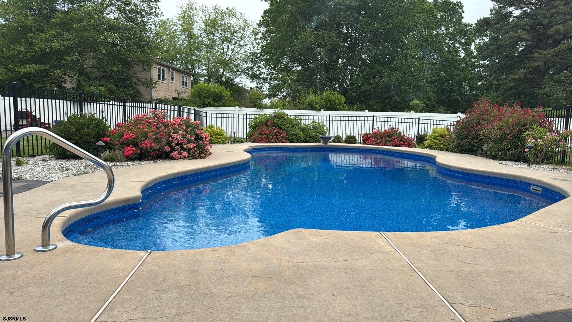 107 Spray Avenue Egg Harbor Township, NJ 08234 - Photo 35 of 38 a view of a swimming pool with a patio