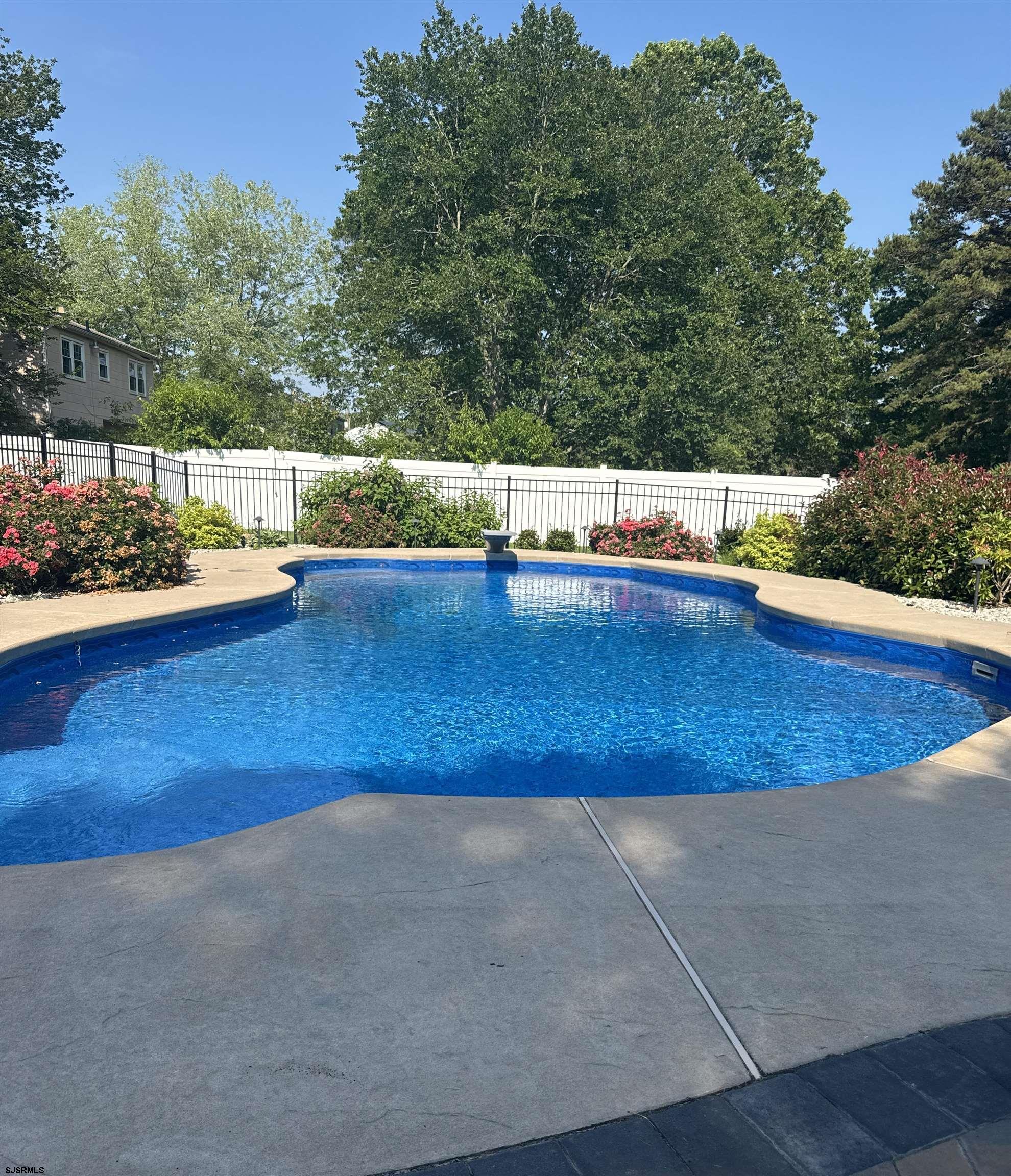 107 Spray Avenue Egg Harbor Township, NJ 08234 - Photo 36 of 38 a view of swimming pool with an outdoor space and seating area