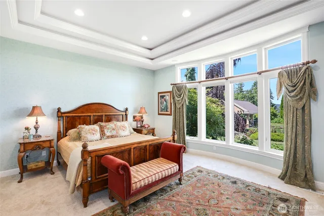 a bed room with a bed and a window