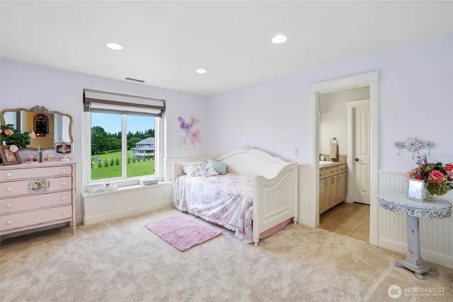 an aerial view of a houses with a yard