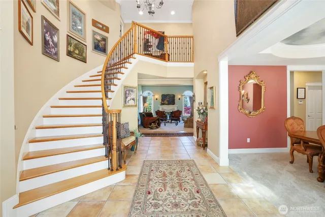 a living room with furniture and a gym machine