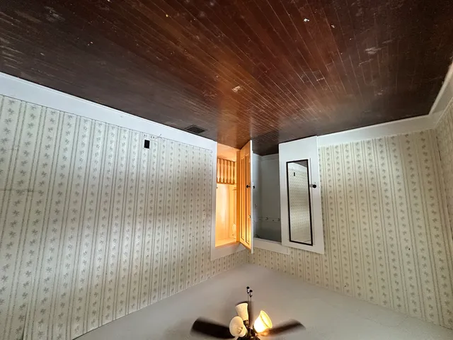 a view of an empty room with a window