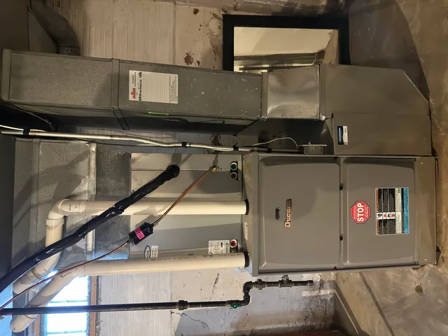 a utility room with a sink and a stove top oven