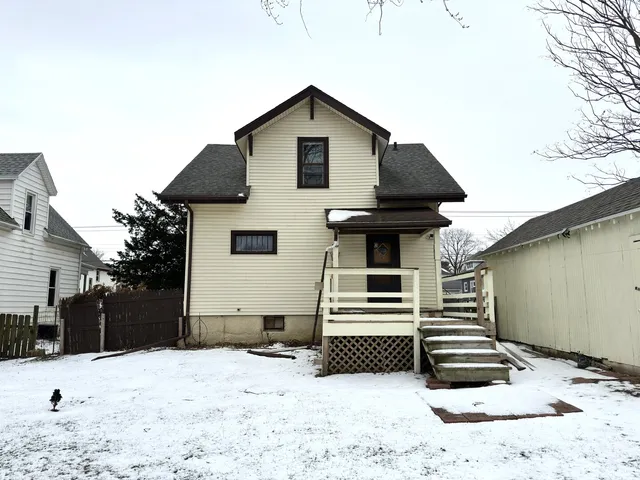 a view of a yard covered with snow in the background
